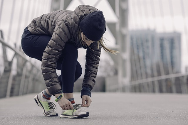 A lady enjoying running outdoors in the winter