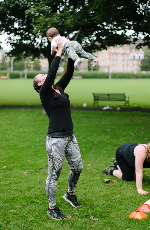 mum lifting her baby at fitandhappy Mamas exercise class