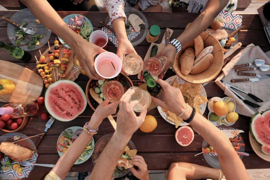 An aerial view of a group of people enjoying a meal outdoors together